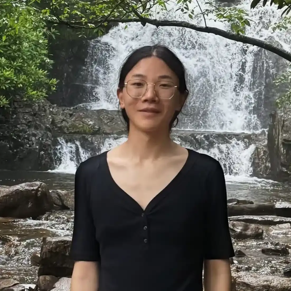 Photo of me standing in front of Bushkill Falls.